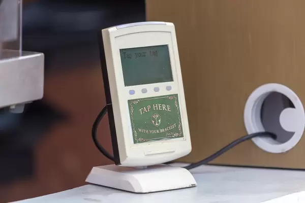 Cashless payment machine at Tomorrowland festival: festival visitors can pay by tapping their bracelets