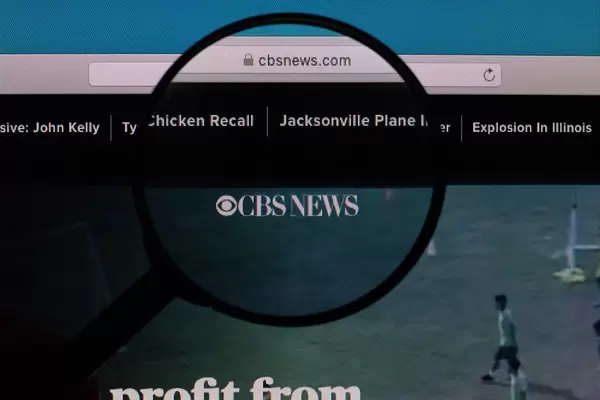 CBS News logo under magnifying glass
