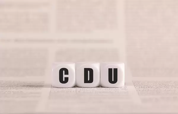 CDU written with cubes on a newspaper