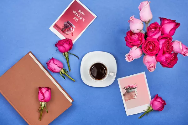 Celebrating Saint Valentine's day at home, drinking coffee and reading book