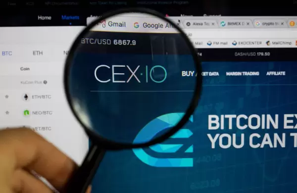 CEX10 logo on a computer screen with a magnifying glass