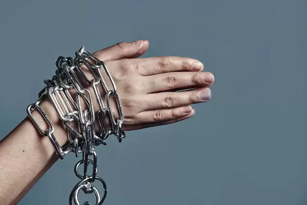 Chained hands of a slave