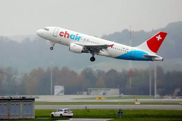 Chair Airlines plane, airbus A319 taking off from Zurich Airport, HB-JOG