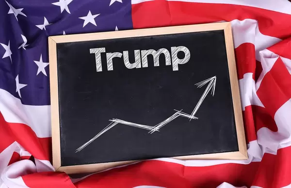 Chalkboard with Trump? text on American flag