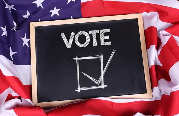 Chalkboard with Vote text on American flag