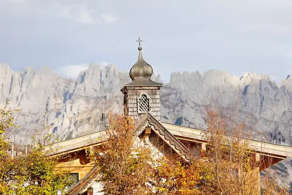 Chapel at Brenneralm, Kufstein, Austria. Wilder Kaiser mountains on background (Flip 2019)