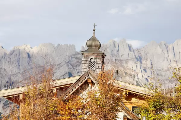 Chapel at Brenneralm, Kufstein, Austria. Wilder Kaiser mountains on background