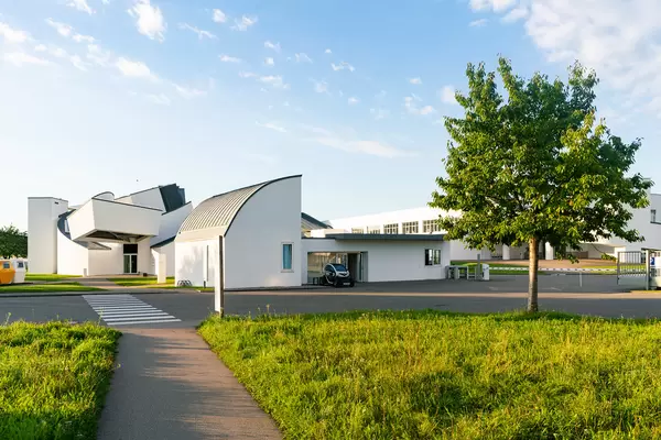 Checkpoint on Vitra museum campus with security guard’s EV charging next to it
