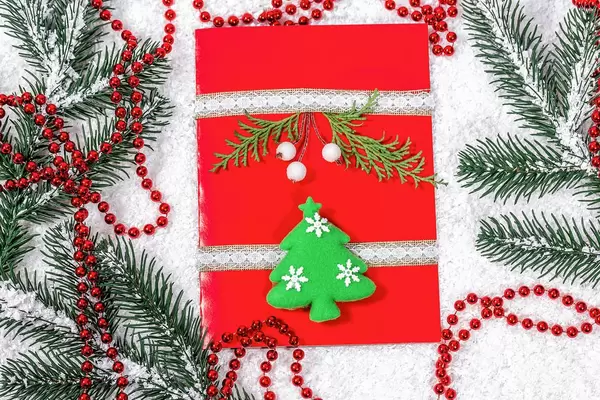 Cheerful handmade Christmas card on winter new year background