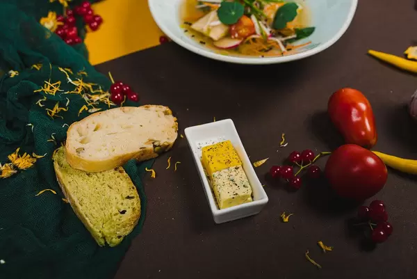 Cheese, Bread And Vegetables On The Table