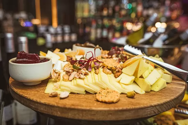 Cheese Plate Asorti With Walnuts, Jam And Greens