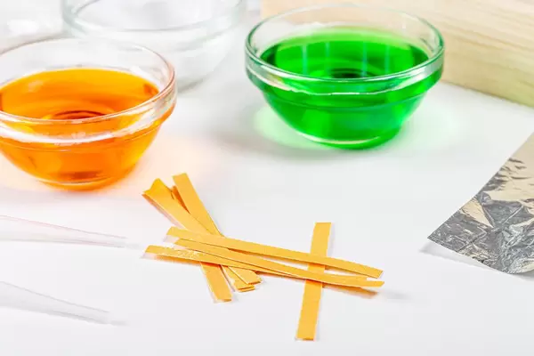 Chemical solutions and indicator paper. Analysis concept (Flip 2020)