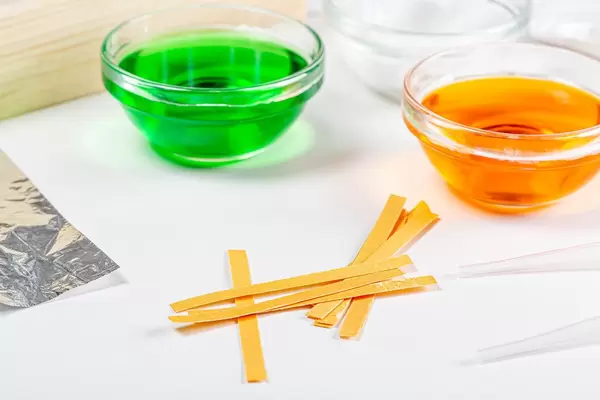 Chemical solutions and indicator paper. Analysis concept