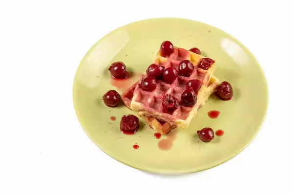 Cherry Compote served with Waffles on the plate