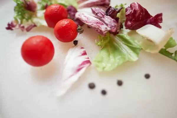 Cherry tomatoes and fresh letuce close up