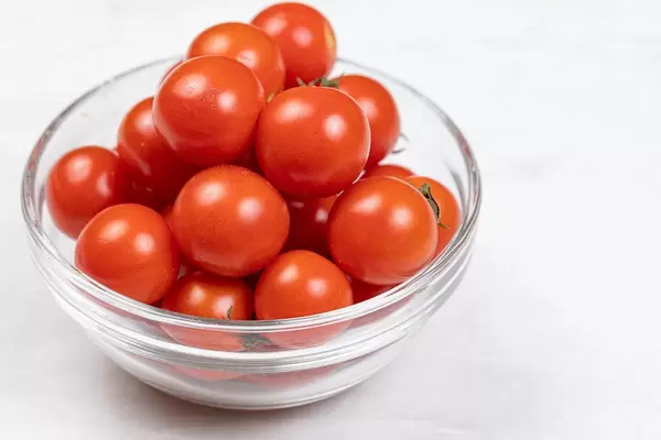 Cherry Tomatoes served in the glass bowl