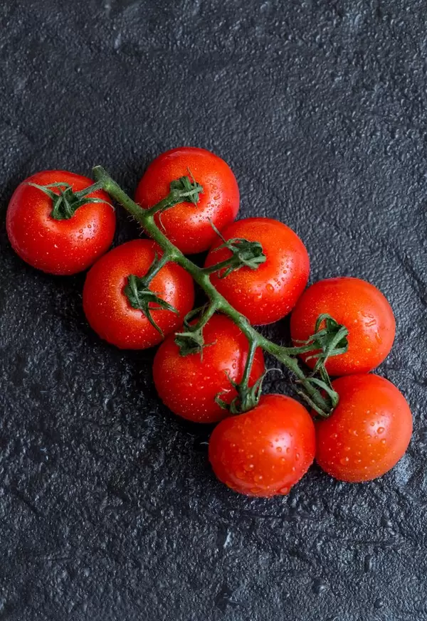 Cherry tomatoes with green leaves  Flip 2019
