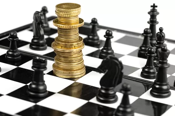 Chess game on chessboard, money and chess - concept strategy, investment and success
