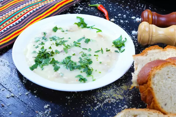 Chicken and mushrooms cullama, Turkish cuisine, black background (Flip 2019)