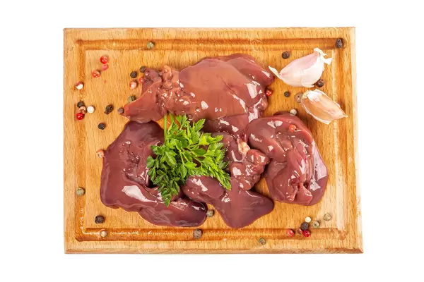 Chicken liver with spices, garlic and parsley, top view