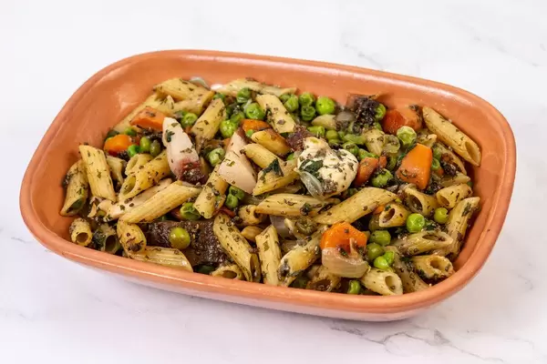 Chicken meat with Bacon and vegetables and pasta above white background (Flip 2019)