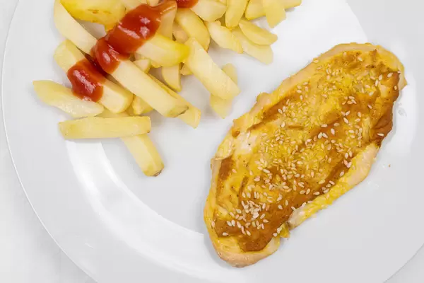 Chicken Meat with mustard and sesame served with potatoes