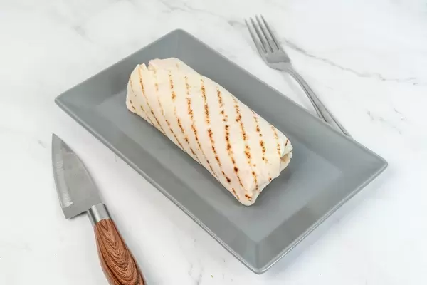 Chicken Meat with Vegetables in Tortilla served on the plate (Flip 2019)