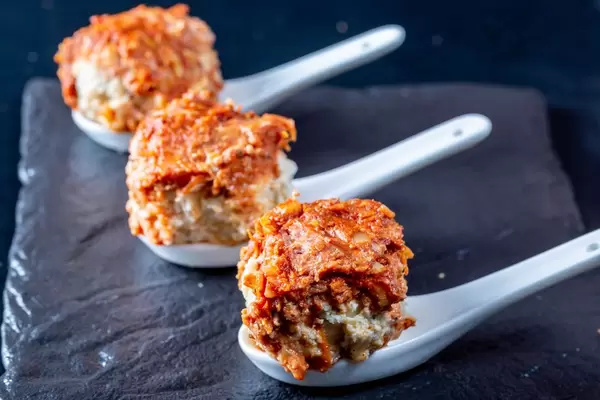 Chicken Meatballs on a black stone background