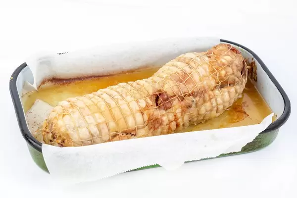 Chicken rolled with ham and cheese baked in the oven