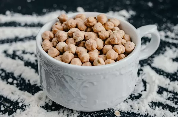 Chickpeas for baking in a cup on the kitchen table