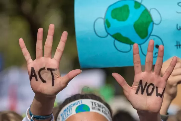 Children demand "ACT NOW" at United for climate global movement march in Cologne Germany