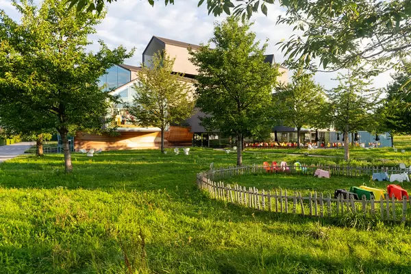 Children playground and garden on Vitra museum campus with VitraHaus in the background
