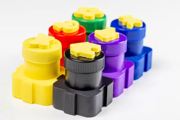 Children's finger paints of different colors on a white background