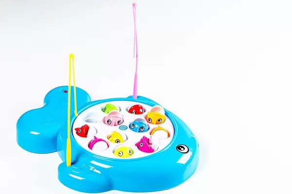 Children's game fishing with colorful fish and two fishing rods