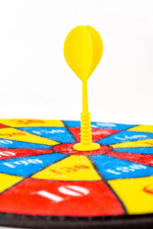 Children's multi-colored dart game with a yellow dart in the center