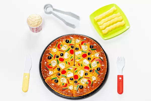 Children's plastic food toy set on white background (Flip 2019)