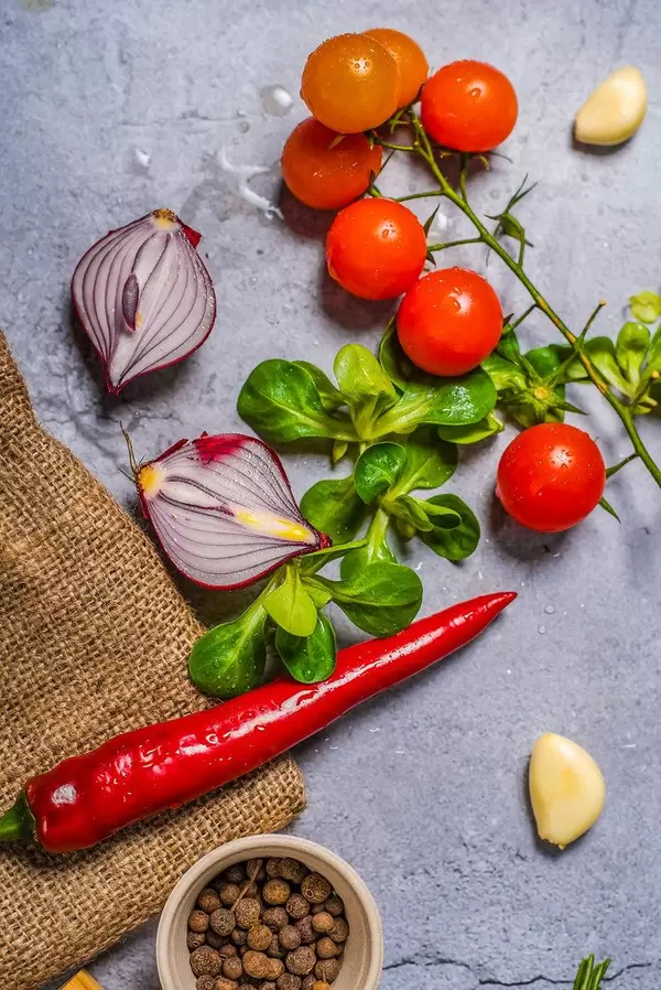 Chilli pepper and veggies on background