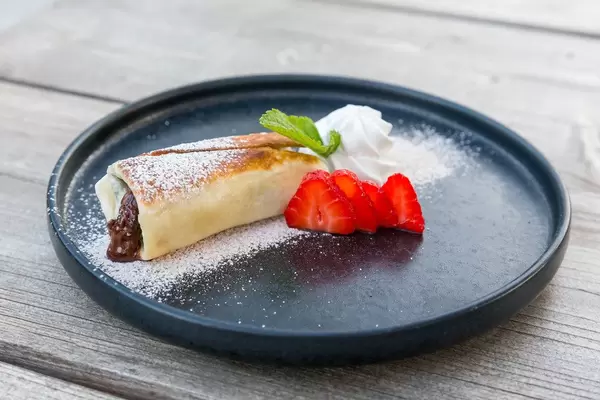 Chimichanga: fried tortilla filled with chocolate and strawberry. Vegan Mexican dessert at Villa Vegana