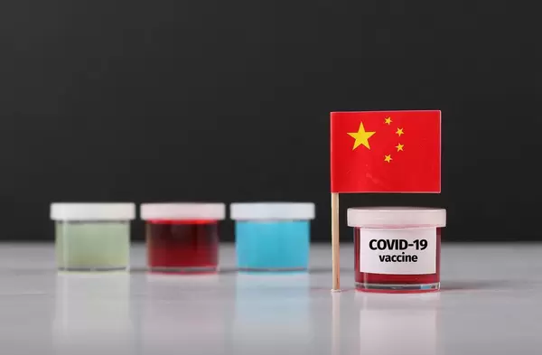 Chinese flag with Covid-19 vaccine