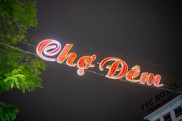 Cho Dem Night Market LED Sign Board hanging on Electric Wires at the Entrance of Dalat Street Night Market in Da Lat, Vietnam