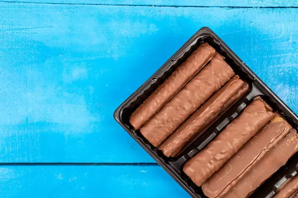 Chocolate Bars on the blue wooden table