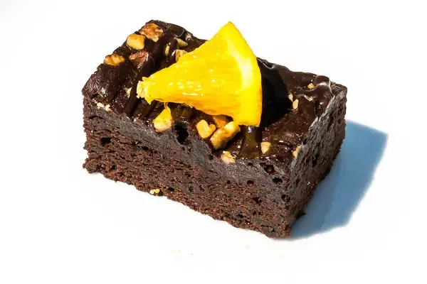Chocolate brownie with an orange slice on top