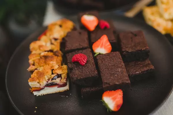 Chocolate Brownie With Berries On Black Plate (Flip 2019)