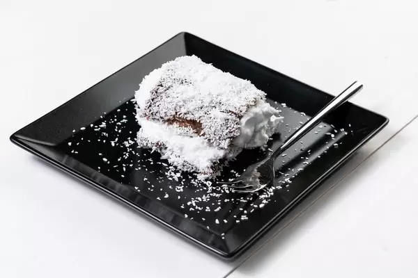 Chocolate cake with a lots of coconut served on the plate