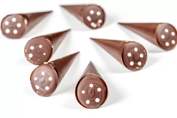Chocolate candies in the shape of a cone on a white background (Flip 2020)