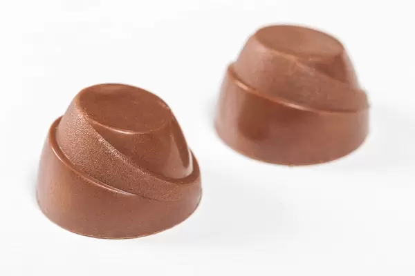 Chocolate candies on white background close up (Flip 2019)