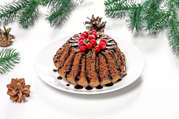 Chocolate cupcake with red currants on Christmas background (Flip 2019)