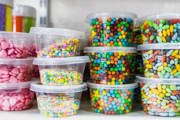 Chocolate filled candies on small containers