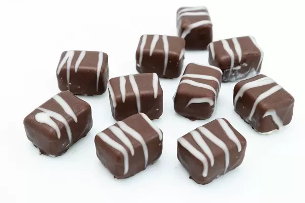 Chocolate Pralines on the white background (Flip 2019)