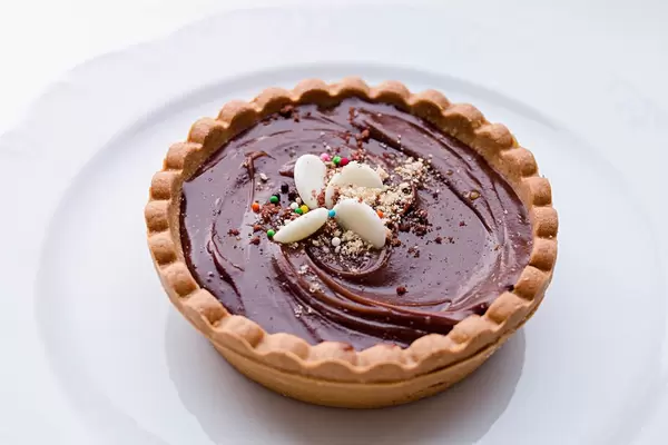 Chocolate tart and colorful sprinkles